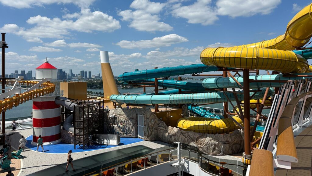 Multiple waterslides, a lighthouse play area, and a ropes course at The Harbour on MSC World America