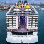 The back of MSC World America, which rises 22 decks and includes views of the World Promenade area and the waterslides in The Harbour district