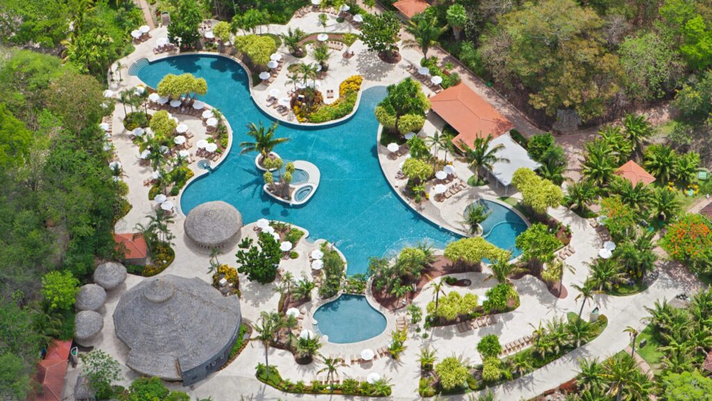 An aerial view of the lagoon-style pool at The Westin Reserva Conchal, An All-Inclusive Golf Resort & Spa