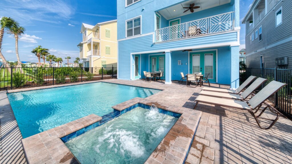 A blue three-level cottage at Margaritaville Resort Orlando with a private pool and hot tub