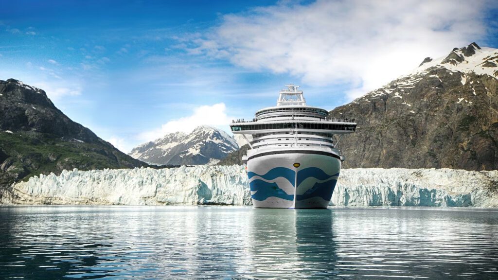Cruise ship with glacier and mountains in the background