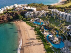 An aerial view of the buildings, pools, and beach at Sheraton Maui Resort & Spa