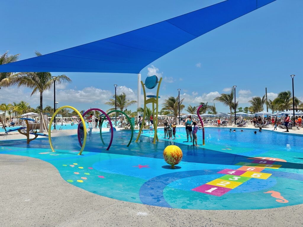 A splash pad with water features and shade for little kids