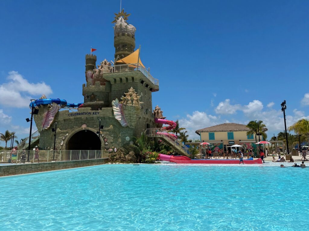 Sand castle-inspired tower with water slides that exit riders into a large lagoon