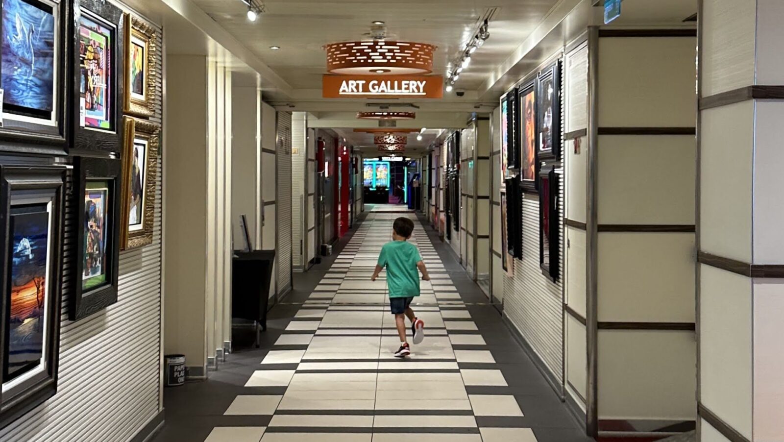 Child running down a hallway on a cruise ship