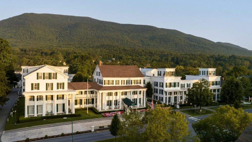An aerial view of Equinox Golf Resort with mountains behind it