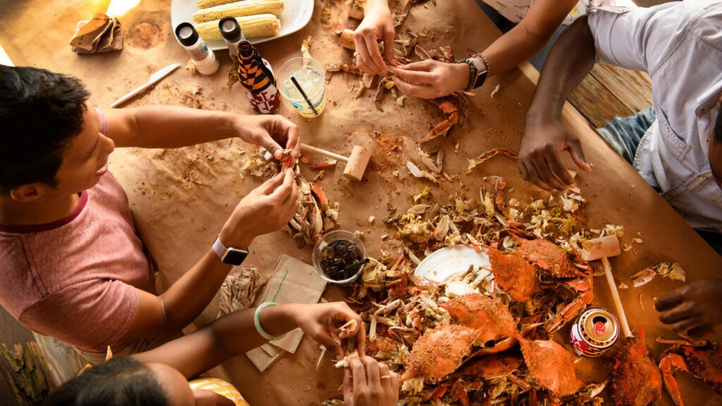 A group of people eating crabs at a restaurant in Maryland