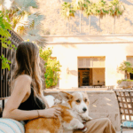 A woman and a dog outside at Royal Palms Resort and Spa, part of The Unbound Collection by Hyatt