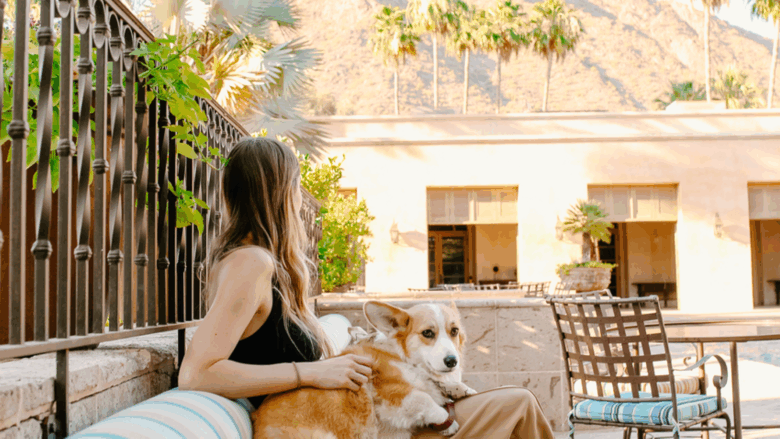 A woman and a dog outside at Royal Palms Resort and Spa, part of The Unbound Collection by Hyatt