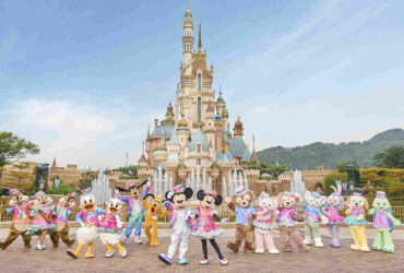 Hong Kong Disneyland's castle with characters in front of it.