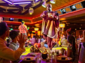 Family eating dinner on Disney Destiny