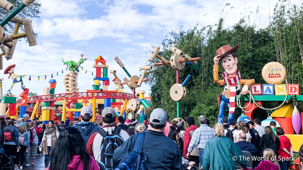 Crowds make their way through Toy Story Land at Disney's Hollywood Studios during the holiday season.