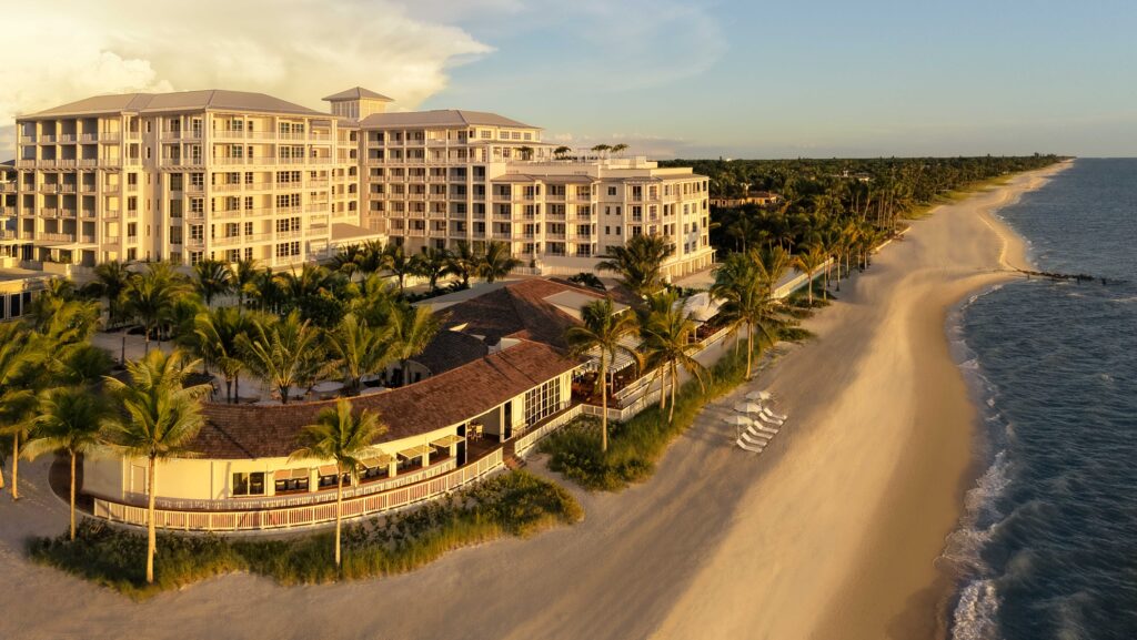 An aerial view of the beach and hotel property at Naples Beach Club