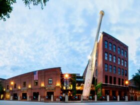 The exterior of the Louisville Slugger Museum & Factory with its giant bat