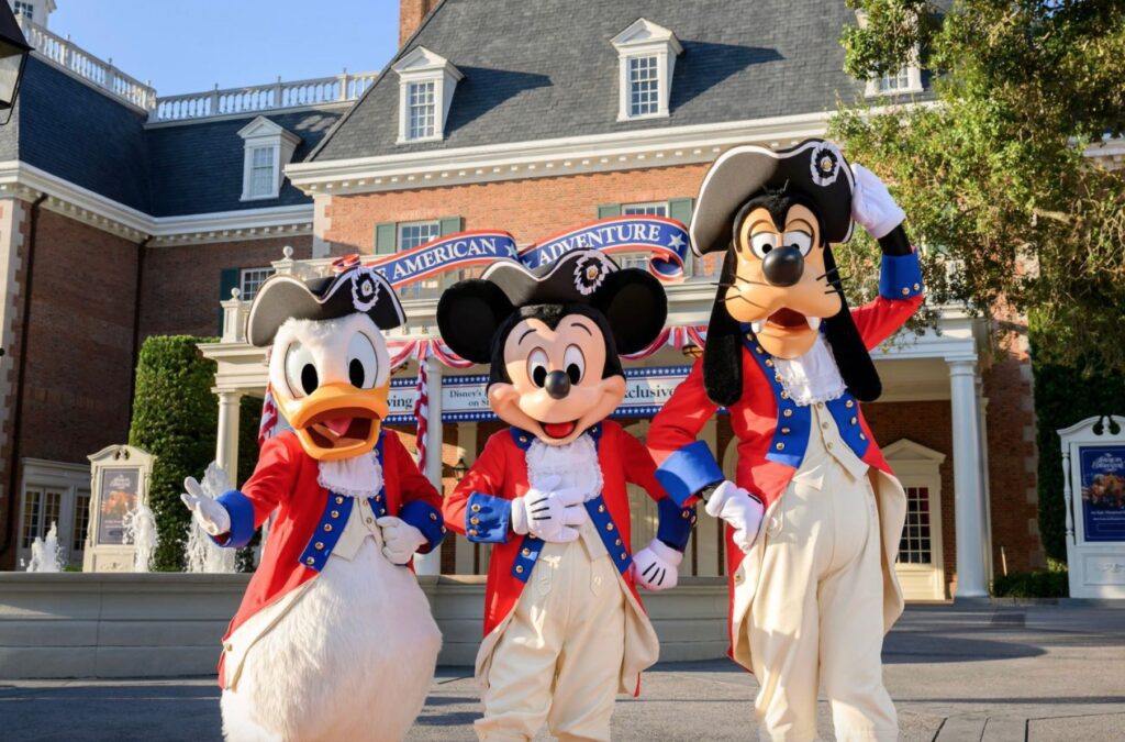 Donald Duck, Mickey Mouse and Goofy wear patriotic attire at EPCOT