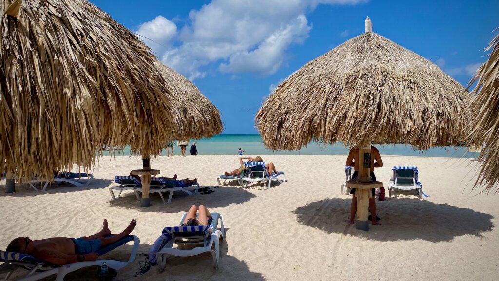 Palapas on the resort beach at Embassy Suites Aruba