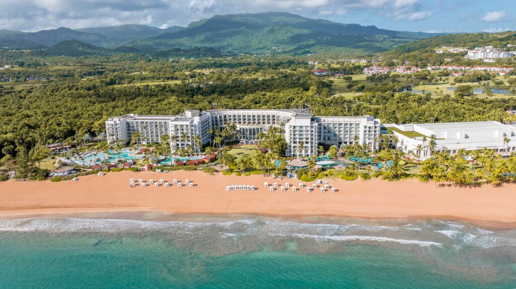 An aerial view of Wyndham Grand Rio Mar Rainforest Beach and Golf Resort in Puerto Rico and its beach
