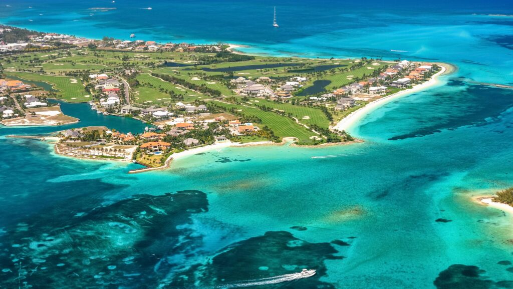 An aerial view of Nassau's Paradise Island with turquoise water surrounding it