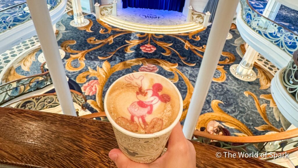 Latte with Mickey Mouse latte foam art in the Grand Hall of the Disney Wish