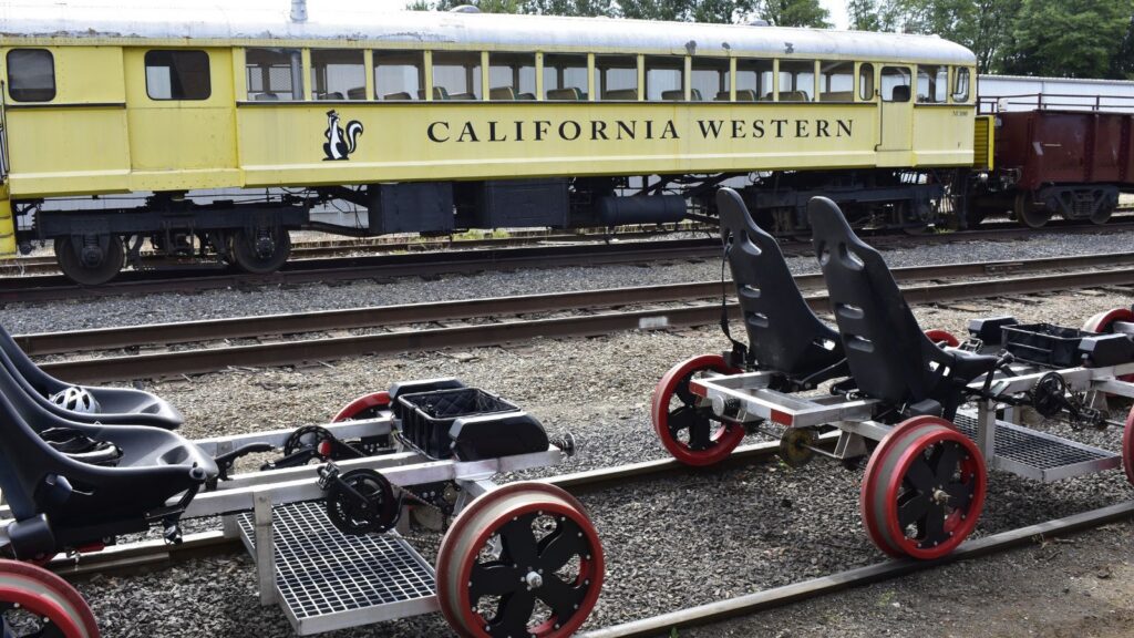 Skunk Trail Railcoaster Railbikes with train in background