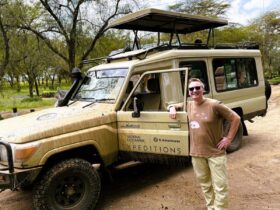 Author at the gates of Lake Nakuru National Park, Kenya (Photo: Dave Parfitt)