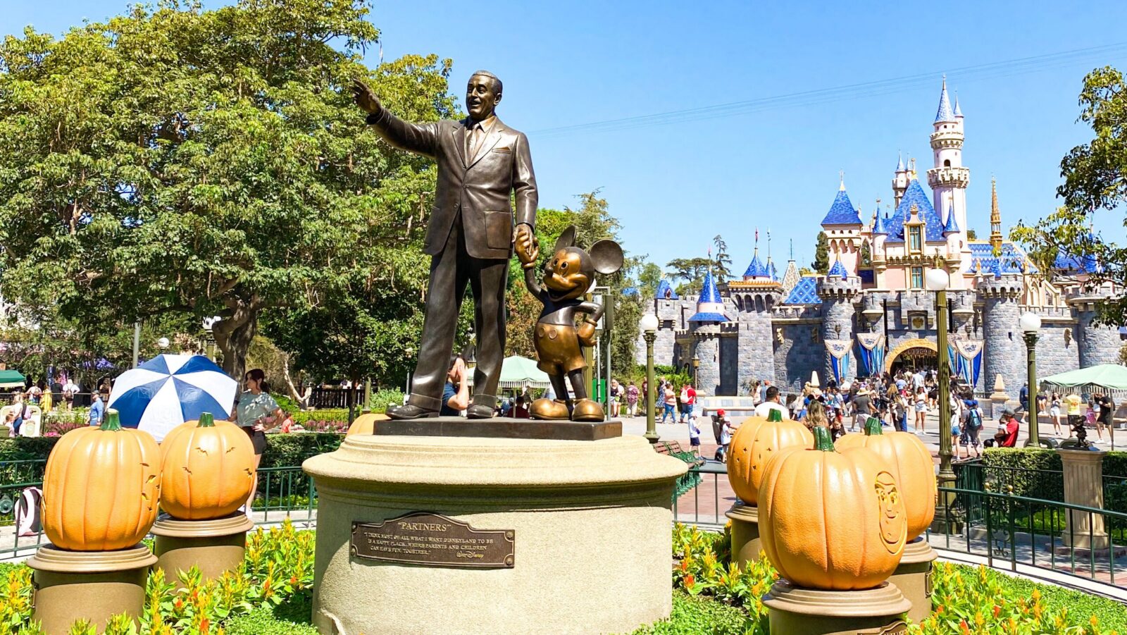 Sleeping Beauty Castle and the Partners Statue at Disneyland Park decorated for Halloween