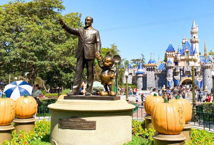 Sleeping Beauty Castle and the Partners Statue at Disneyland Park decorated for Halloween