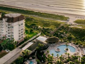 An aerial view at sunset of The Ritz-Carlton, Amelia Island and its beach