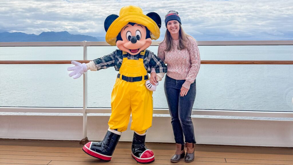 Theme park journalist Carly Neil with Fisherman Mickey Mouse on the Disney Wonder in Alaska