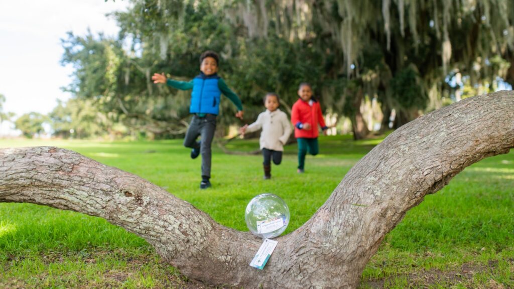 Three kids taking part in the Island Treasures event on Jekyll Island